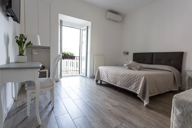 غرفة ديلوكس بسرير كوين وسرير فردي، Residence Le Vie Del Centro 3/7