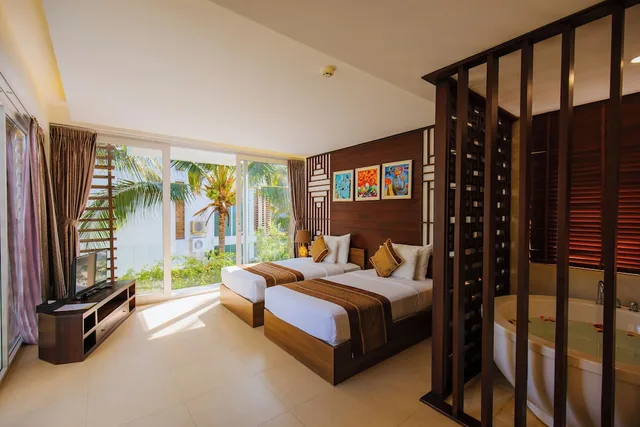 غرفة غراند بريميوم بسرير كينج بإطلالة على الحديقة، Villa Del Sol Beach Villas & Spa 1/10