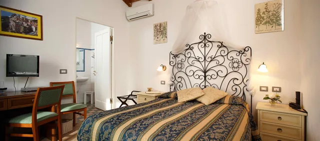 غرفة كلاسيكية ثلاثية بسرير كوين وسرير فردي، Hotel Del Borgo 4/5