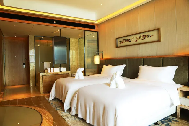 غرفة تنفيذية بسرير كينج بإطلالة على البحر، HARMAN HOTEL SANYA 3/6