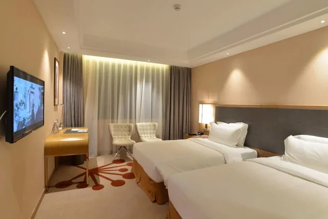 غرفة بسريرين منفصلين بإطلالة على الحديقة، Fliport Garden Hotel Fuzhou 1/4