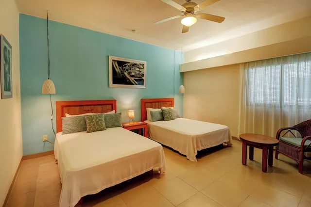 2 Bedrooms, Riviera, 1 King and 2 Double Beds, Garden View، Riviera Maya Suites 10/10