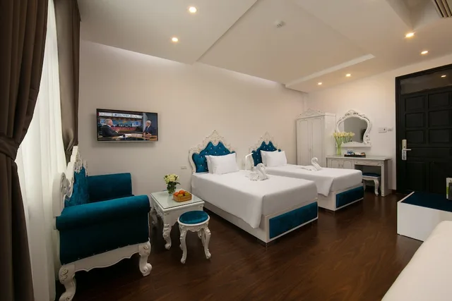 غرفة ديلوكس عائلية بسريرين منفصلين وسرير كينج بإطلالة على المسبح، Hoian Nostalgia Hotel & Spa 7/10