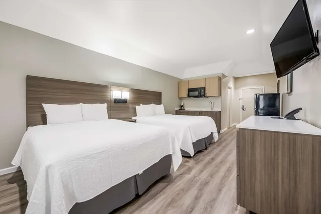 Room, 2 Queen Beds, Kitchenette, SureStay Studio by Best Western Conroe Downtown 5/9