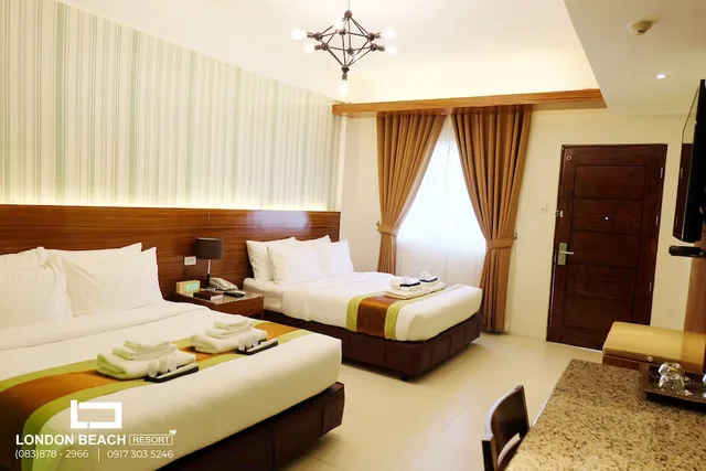 غرفة ديلوكس بسريرين كوين بإطلالة على الحديقة، London Beach Resort And Hotel 2/3