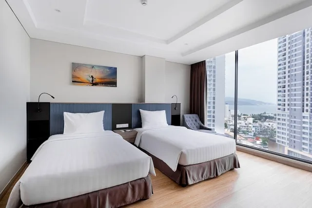 غرفة ديلوكس بسريرين منفصلين بإطلالة على البحر، Areca Hotel Nha Trang 1/7