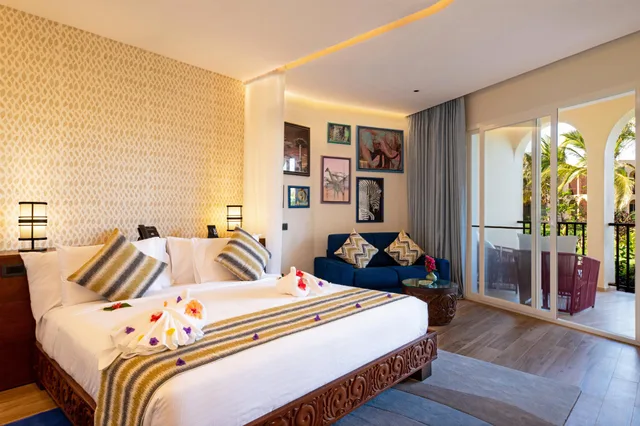 جناح جونيور سوبيريور بسرير كينج مع أريكة، The Mora Zanzibar 1/2
