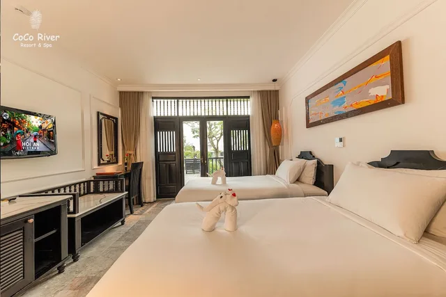 غرفة ديلوكس بسريرين منفصلين بإطلالة على المسبح، Hoi An Coco River Resort Spa 1/2