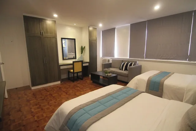 غرفة بسريرين منفصلين، Bryan Condominium Suites 2/6