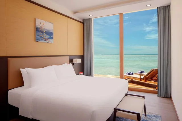 3 Bedrooms, Water Villa, Sunset, 2 King Beds, Private Pool, Lounge Access, Radisson Blu Resort Maldives 1/7