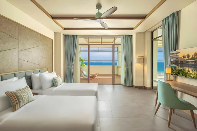 جناح بريميوم بسرير فردي بإطلالة على البحر بغرفتي نوم، Fusion Resort and Villas Da Nang 1/2