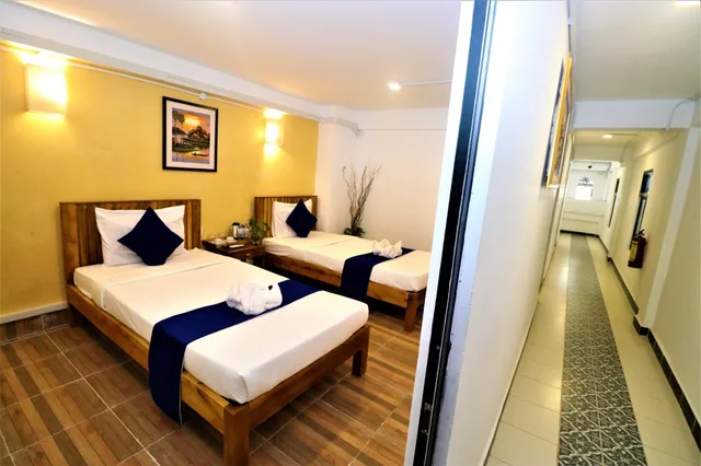 غرفة قياسية بسريرين منفصلين بحمام مشترك، Grand Elevation Hotel 2/3