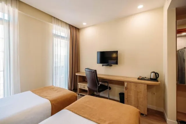 غرفة اقتصادية بسرير كينج وسريرين منفصلين بغرفة نوم واحدة، Atrium Boutique Hotel 2/3