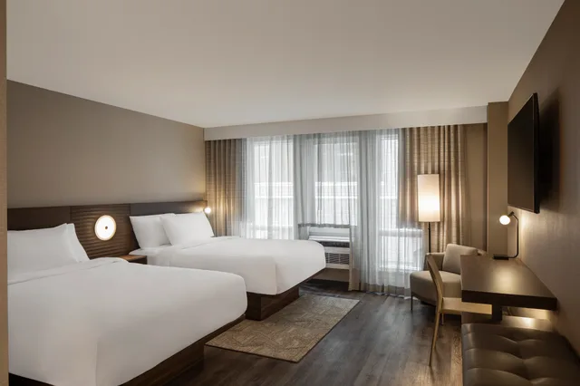 Guest room 2 queen beds + sofabed، AC Hotel Old Montreal 1/4