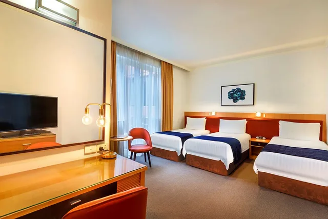 غرفة ديلوكس بسرير كوين وسرير فردي، Best Western Plus Travel Inn Hotel 1/9