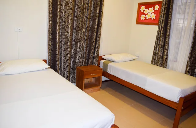شقة ديلوكس بسرير كينج وسريرين منفصلين بغرفتي نوم، Al-Minhaj Service Apartments 1/5