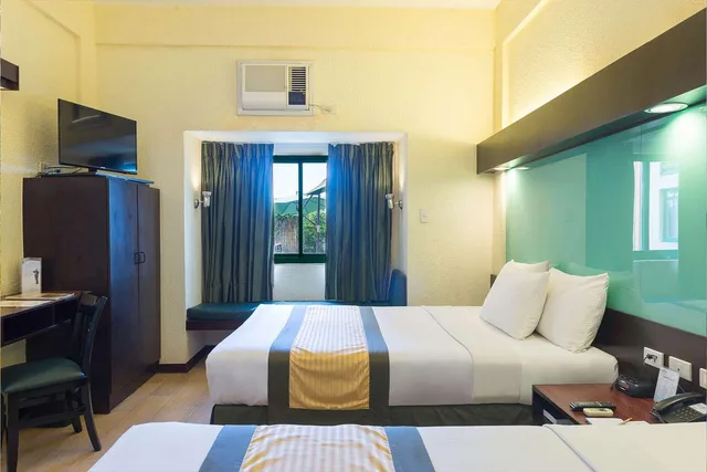 غرفة رباعية بسريرين كوين، Microtel By Wyndham Cabanatuan 1/4