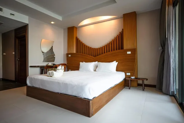 غرفة ديلوكس عائلية بسرير كينج وسريرين منفصلين بإطلالة على البحر، Dusit Buncha Resort 3/5