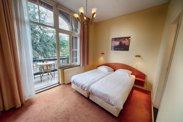 غرفة قياسية بسريرين منفصلين بشرفة، Fletcher Hotel Gilde 1/3