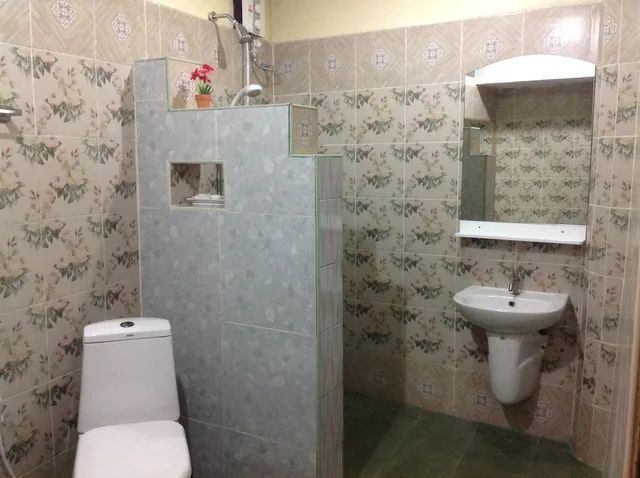 غرفة ديلوكس ثلاثية بسرير مزدوج وسرير فردي، Ruan Mai Naiyang Beach Resort 1/2