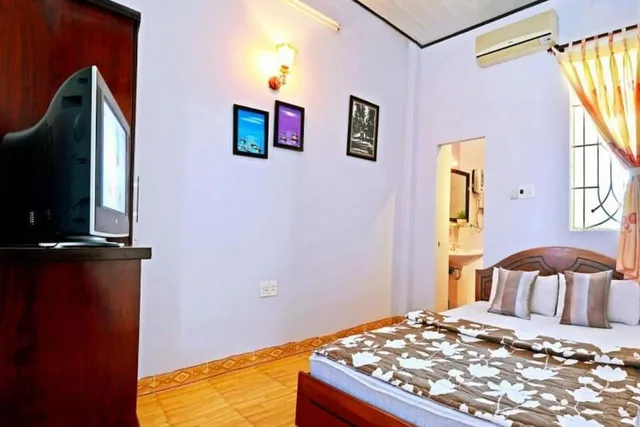 غرفة عائلية بسرير كوين وسرير فردي بإطلالة على الحديقة بشرفة، Green Garden Homestay 3/6