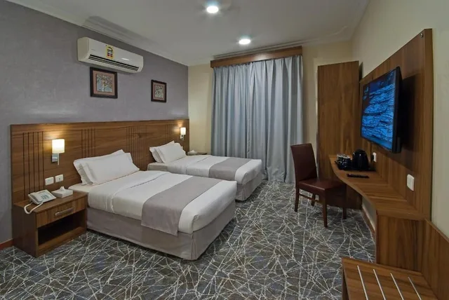 2 Bedrooms, Elite, Suite, Twin Beds, King Bed, 2 Bathrooms, Delights Inn 1/3