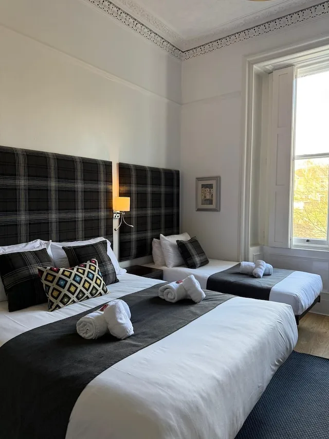 غرفة عائلية بسرير مزدوج وسرير فردي، The International Guest House 1/10