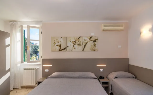 غرفة قياسية ثلاثية بسرير كوين وسرير فردي، Hotel Eura 5/8