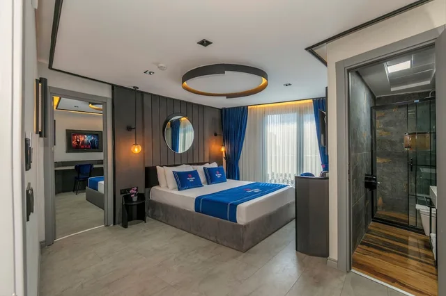 غرفة ديلوكس رباعية بسرير كوين وسريرين منفصلين، The Private Airport Hotel 1/7