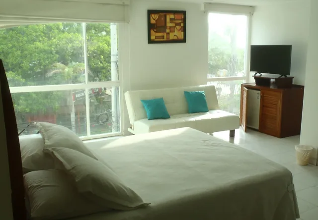 غرفة ديلوكس ثلاثية بسرير مزدوج مع أريكة، Coral Reef Hotel 4/9
