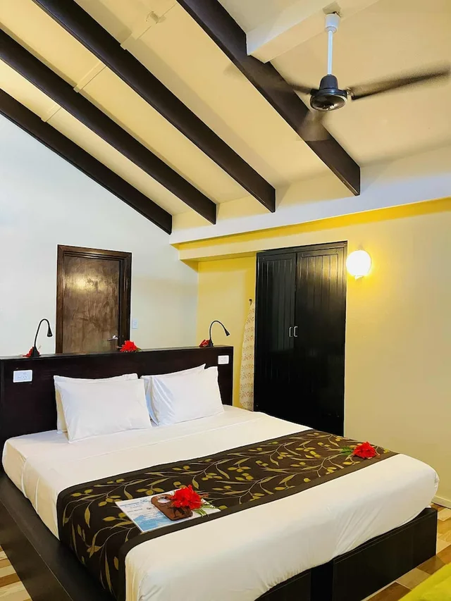 غرفة بسرير كينج وسرير فردي بإطلالة على البحر، Mana Island Resort 1/10