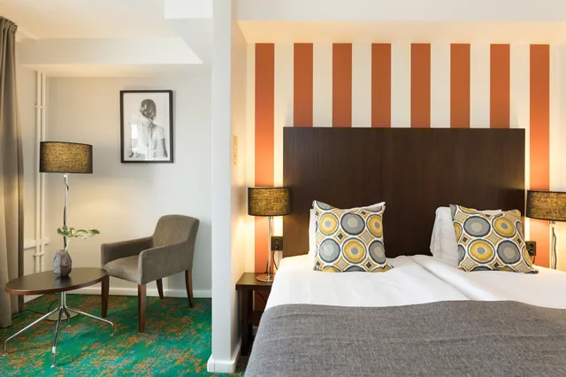 غرفة كلاسيكية بسرير كوين مع أريكة، Profilhotels Garden 5/6