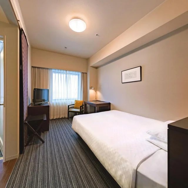 غرفة بسرير نصف مزدوج للمدخنين، Centrair Hotel 1/5
