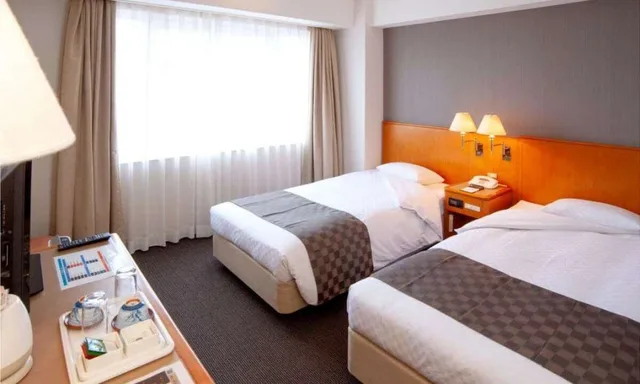 غرفة قياسية بسريرين منفصلين للمدخنين، JR Hotel Clement Uwajima 1/1