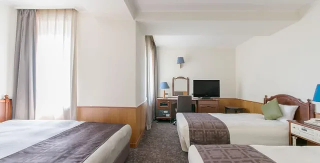 غرفة عائلية بسرير كوين وسرير فردي، Premier Hotel Cabin Obihiro 1/3