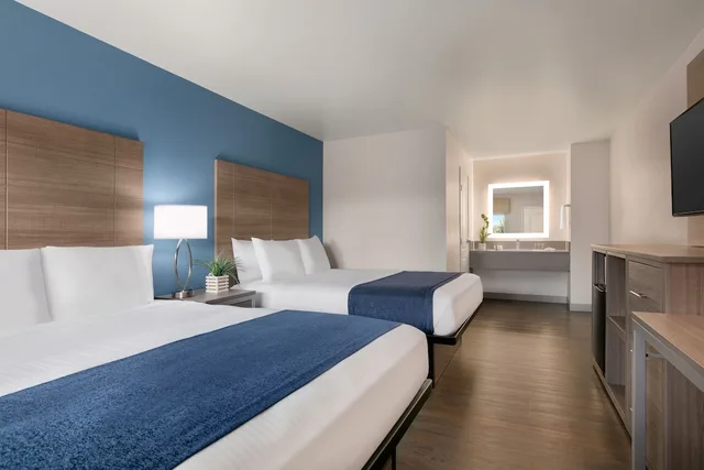 غرفة سيغنتشر بسريرين كوين، Torch Lite Inn 2/5