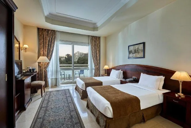 جناح جونيور، Triumph Plaza Hotel 1/2