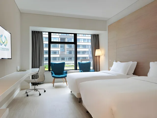 غرفة بسريرين منفصلين، Garden Lane Meilan Airport Hotel Formerly Haikou Meilan Airport Hotel 1/1