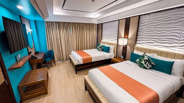 غرفة ديلوكس رباعية بسريرين مزدوجين، Puerto De San Juan Beach Resort Hotel 1/3