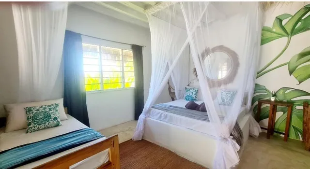 غرفة ديلوكس بسرير مزدوج مع سرير إضافي، Garden Beach Bungalows 2/10