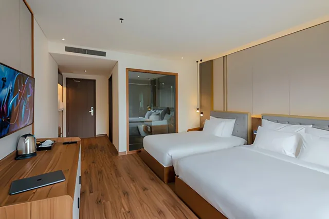 غرفة ديلوكس ثلاثية بإطلالة على الحديقة، The Tahiti Beach Hotel Phu Quoc 1/2