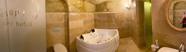 غرفة فاخرة بسرير مزدوج بحوض جاكوزي، Urgup Inn Cave Hotel 1/2