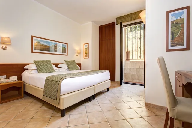 غرفة اقتصادية بسرير مزدوج أو سريرين منفصلين، Hotel Athena Siena 1/5