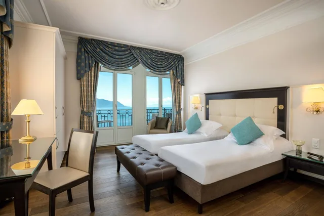 غرفة ديلوكس بسرير فردي بإطلالة على البحيرة بشرفة، Grand Hotel Suisse Majestic 2/5