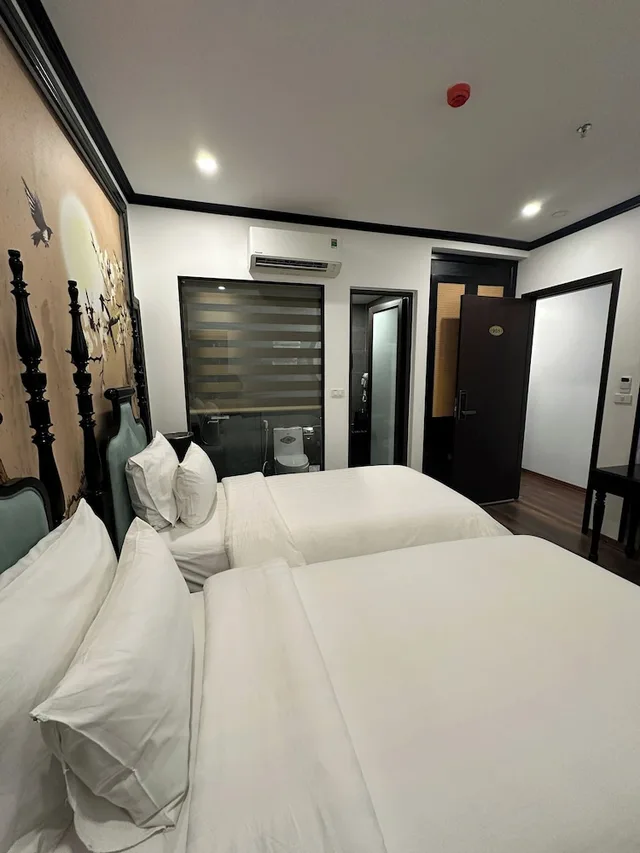 غرفة ديلوكس رباعية بسرير كينج وسريرين منفصلين، Aquarius Premium Hotel 3/7
