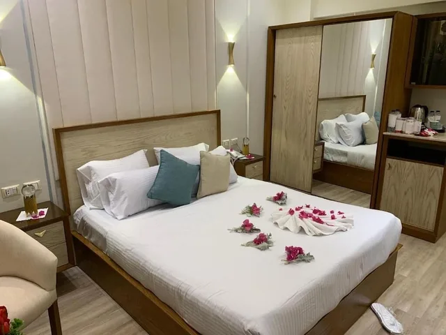 غرفة بسرير كينج وسرير كوين بإطلالة على الحديقة، Ramage Hotel & Resort 3/6