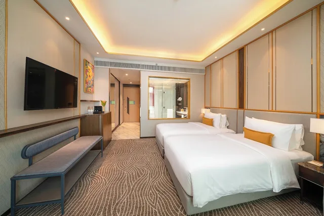 غرفة ديلوكس بسريرين منفصلين بإطلالة على البحر، Fili Hotel at NUSTAR Resort & Casino Cebu 1/4