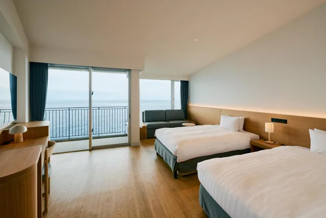 غرفة قياسية بسريرين منفصلين بإطلالة على البحر مع أريكة، Samana Hotel Yakushima 2/3