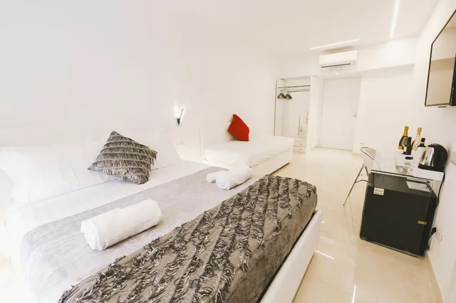 غرفة قياسية رباعية بسرير كوين وسريرين منفصلين بإطلالة على المدينة، San Pietro Grand Suite 3/5