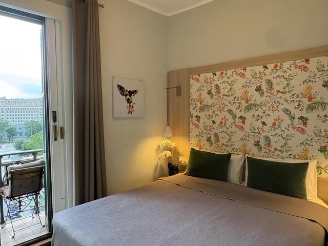 غرفة بسرير مزدوج أو سريرين منفصلين بإطلالة، Hotel Ginebra 1/8